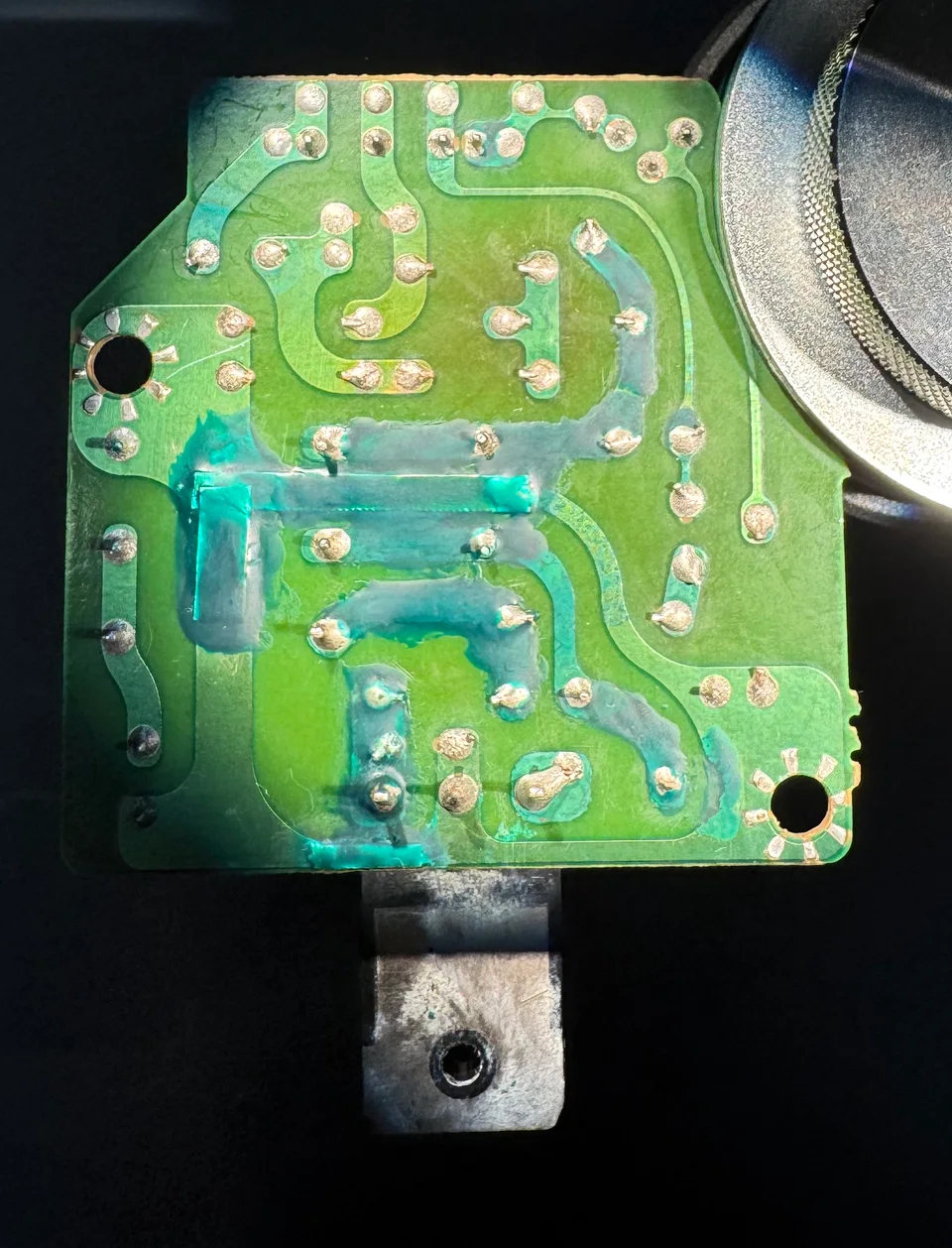 The humidifier circuit board after damaged traces were repaired.